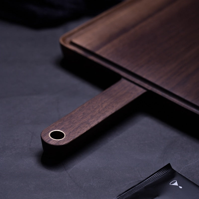 Close up of the Product image of the Black Walnut Wooden Cutting Board showing the dark rich wood color, and complex wood grain.