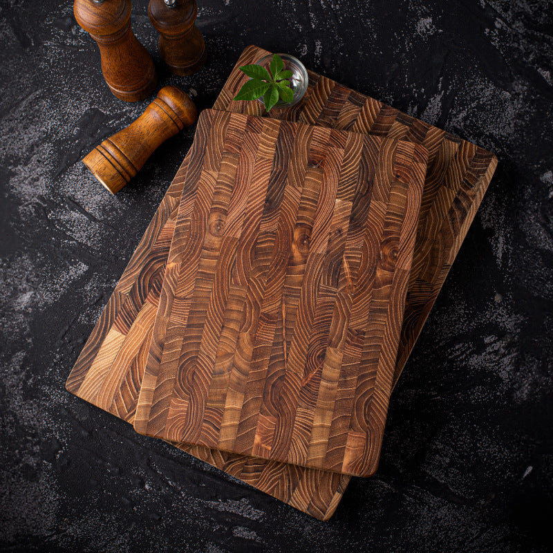 The small and large Walnut Wood Chopping Board stacked on-top of each other showcasing the amazing wood grain and rich colors.