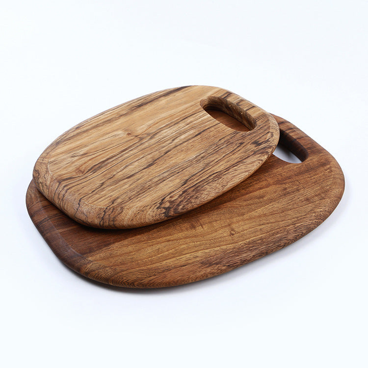 The small and large One-Piece Zebra Wood Cutting Board stacked on-top of each other, showing the beautiful wood grain and brown wood color.