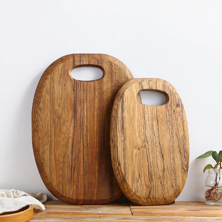 The small and large One-Piece Zebra Wood Cutting Board side by side, showing the wood grain and dark brown coloration.