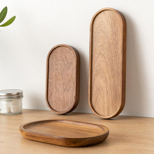 3 Japanese Style Wooden Oval Tray all stacked next to each other, showing the natural wood grain and colors.