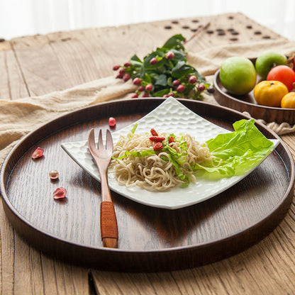 Ash Wood Round Serving Tray holding a plate with salad and ramen noodles.