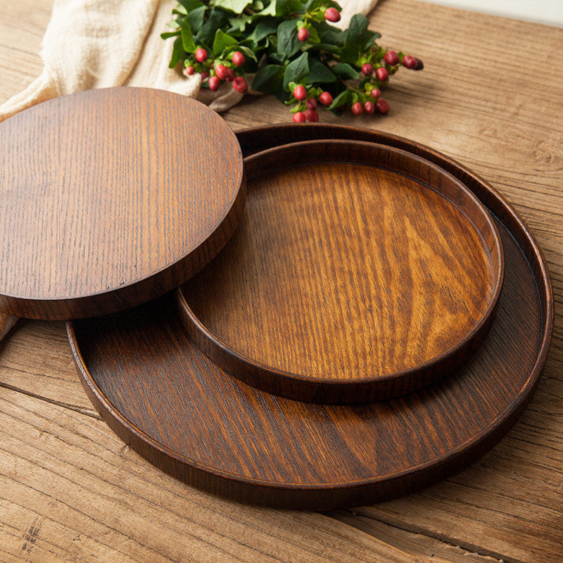 3 Ash Wood Round Serving Tray all stacked on each other from small to large.