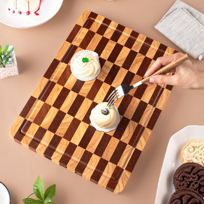 The Acacia End-Grain Checkerboard Wooden Butcher Block with 2 cream desserts on it.
