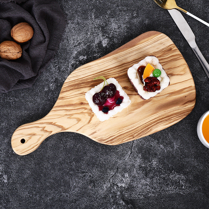 The Olive Wood Irregular Cutting Board with jam and cheese