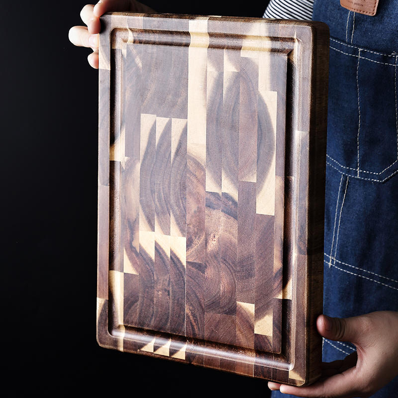 The Parquet Acacia Wood Cutting Board showing the beautiful wood grain, and rich dark brown wood colors.