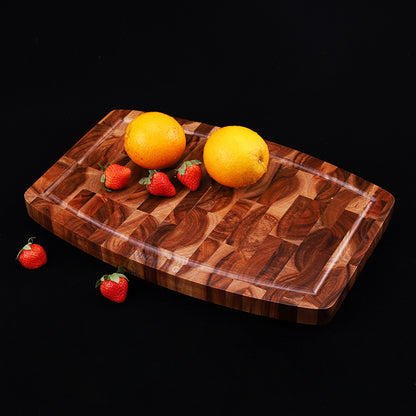 The Wooden Walnut End-Grain Cutting Board with lemons and strawberries on them. Showing a beautiful wood end grain and gorgeous wood color.
