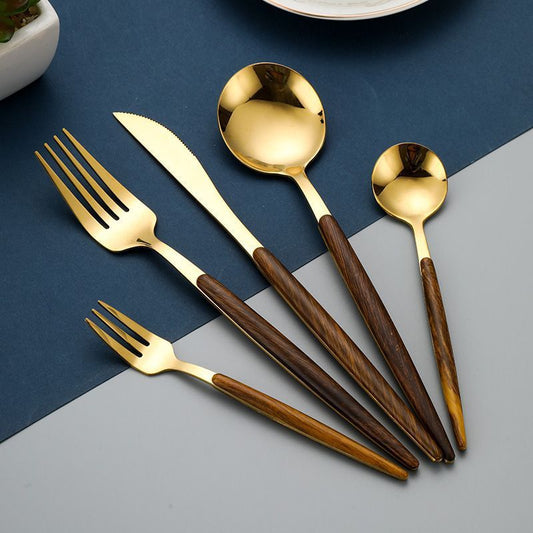 The gold Wooden Handle 5-Piece Cutlery Set that has a wooden handle.