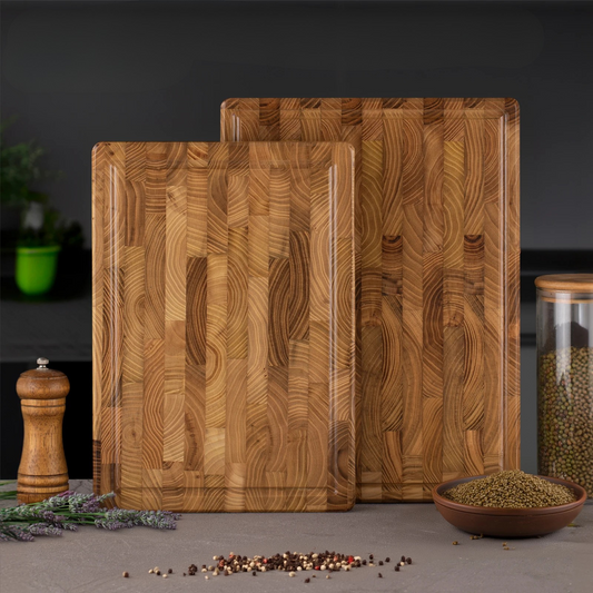 The large and small Teak Wood End-Grain Cutting Board stacked next to each other.