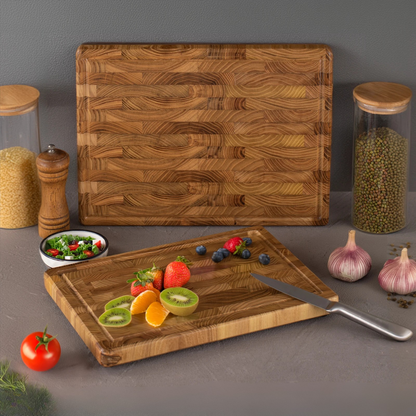 The small Teak Wood End-Grain Cutting Board being used to cut fruits.