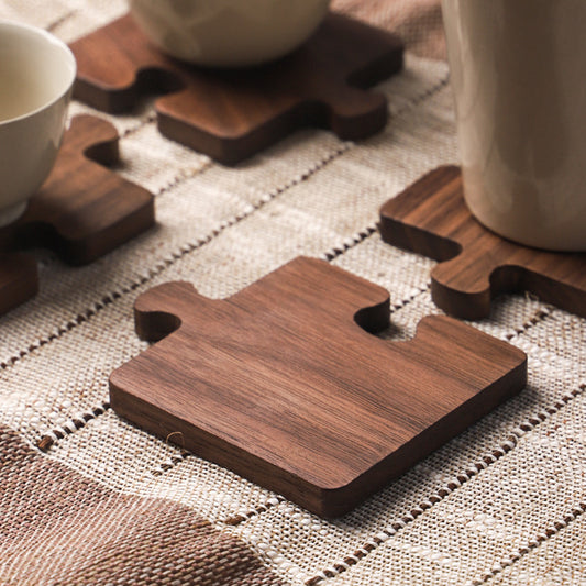The Black Walnut Puzzle Wood Coaster Set close up on the grain structure.