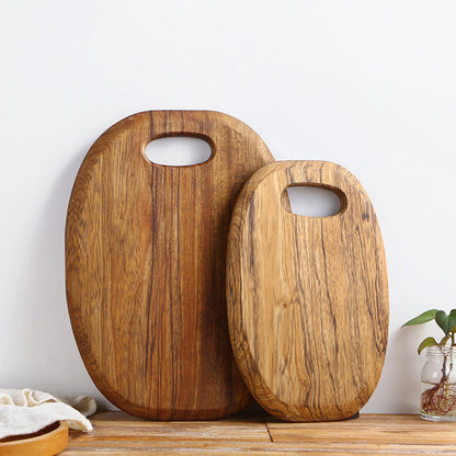 The small and large One-Piece Zebra Wood Cutting Board side by side, showing the wood grain and dark brown coloration.