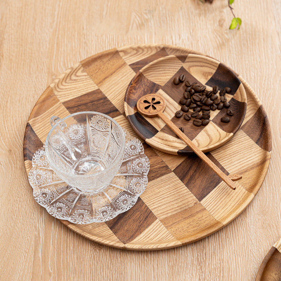Wooden Checkered Tray with a glass mug on it, with a smaller checkered tray holding coffee beans on it.
